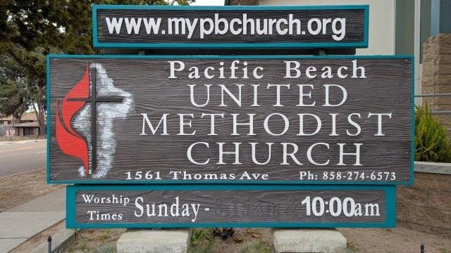Church sign showing address and service time